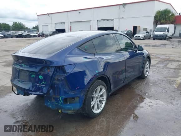 2022 Tesla Model Y Long Range z VIN 7SAYGAEE1NF399523, wystawiony jako IAAI lot #43175077 z przebiegiem 115 467 mil mil oraz . Historia ofert i sprzedaży dostępna na DreamBid. Obrazek 4.