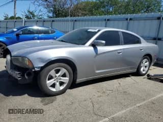 2014 Dodge Charger SE with VIN 2C3CDXBG4EH130116, listed as a Copart auction lot 69834515 with 128,661 mi miles and Salvage title. Bid and sale history available at DreamBid. Image 1.