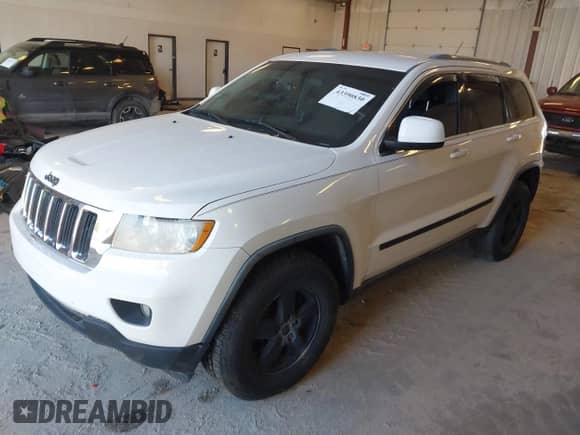2012 Jeep Grand Cherokee Laredo with VIN 1C4RJFAG8CC141355, listed as a IAAI auction lot 43390830 with 173,259 mi miles and . Bid and sale history available at DreamBid. Image 2.