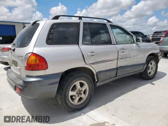 2003 Hyundai Santa Fe GLS z VIN KM8SC13DX3U442040, wystawiony jako Copart lot #61074175 z przebiegiem 20 318 mil mil oraz Szkoda całkowita • Salvage title. Historia ofert i sprzedaży dostępna na DreamBid. Obrazek 3.