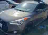 2013 Hyundai Veloster Turbo с VIN KMHTC6AE3DU097576, выставлен на аукционе Copart как лот 82102005 с пробегом 140 467 миль миль и Чистый • Clean title. История ставок и продаж доступна на DreamBid. Изображение 2.