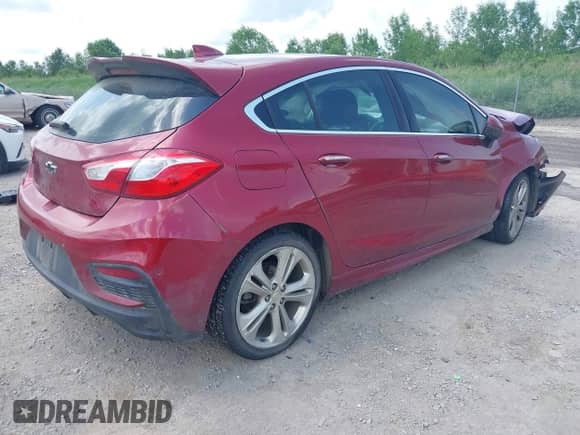 2017 Chevrolet Cruze Premier z VIN 3G1BF6SM1HS547186, wystawiony jako IAAI lot #42536555 z przebiegiem 110 805 mil mil oraz . Historia ofert i sprzedaży dostępna na DreamBid. Obrazek 4.