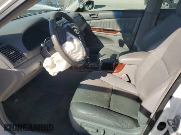 2006 Toyota Camry XLE с VIN 4T1BF32K76U634300, выставлен на аукционе Copart как лот 84736215 с пробегом 175 792 миль миль и Списание • Salvage title. История ставок и продаж доступна на DreamBid. Изображение 7.