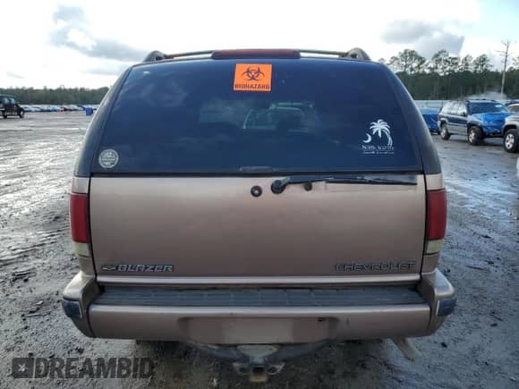 1996 Chevrolet Blazer z VIN 1GNCS13W5T2144687, wystawiony jako Copart lot #80036084 z przebiegiem 196 930 mil mil oraz Szkoda całkowita • Salvage title. Historia ofert i sprzedaży dostępna na DreamBid. Obrazek 6.