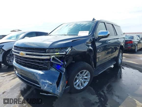 2021 Chevrolet Tahoe LT z VIN 1GNSKNKD4MR271166, wystawiony jako IAAI lot #43227233 z przebiegiem 128 404 mil mil oraz . Historia ofert i sprzedaży dostępna na DreamBid. Obrazek 6.
