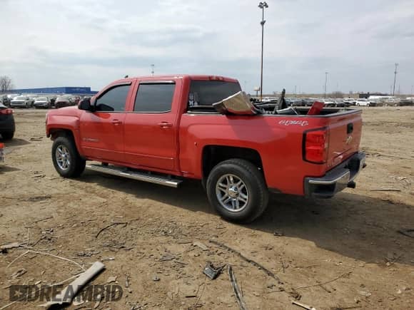2015 Chevrolet Silverado 1500 LT with VIN 3GCUKREH2FG216466, listed as a Copart auction lot 53704635 with 106,148 mi miles and Salvage title. Bid and sale history available at DreamBid. Image 2.