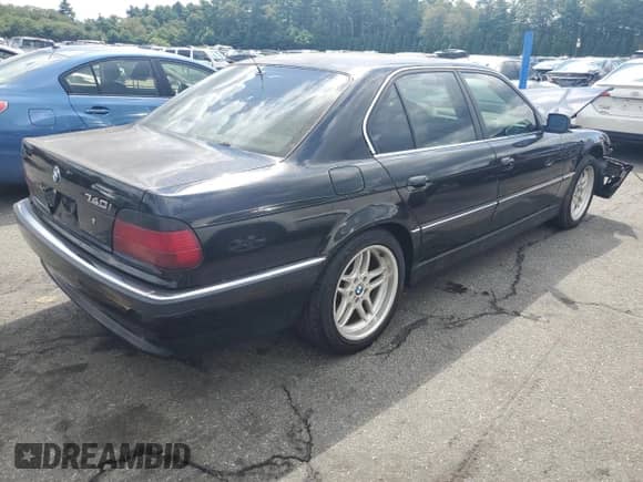 1998 BMW 7 Series 740i with VIN WBAGF8326WDL53656, listed as a Copart auction lot 70682725 with 197,610 mi miles and Salvage title. Bid and sale history available at DreamBid. Image 3.