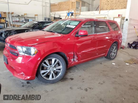 2013 Dodge Durango R/T with VIN 1C4SDJCT2DC664992, listed as a Copart auction lot 68708725 with 71,179 mi miles and Salvage title. Bid and sale history available at DreamBid. Image 1.