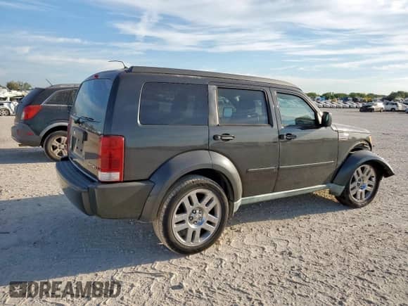 2011 Dodge Nitro Heat with VIN 1D4PT4GK9BW570618, listed as a Copart auction lot 84421505 with 76,339 mi miles and Salvage title. Bid and sale history available at DreamBid. Image 3.