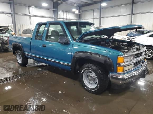 1997 Chevrolet Silverado 1500 with VIN 1GCEC19WXVE216345, listed as a Copart auction lot 82008794 with 167,116 mi miles and Salvage title. Bid and sale history available at DreamBid. Image 4.
