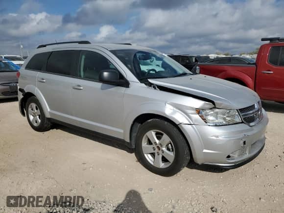 2012 Dodge Journey American Value with VIN 3C4PDCAB8CT184566, listed as a Copart auction lot 87305905 with 42,179 mi miles and Salvage title. Bid and sale history available at DreamBid. Image 4.