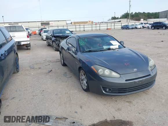 2007 Hyundai Tiburon GT with VIN KMHHN66F47U238578, listed as a IAAI auction lot 41577890 with 182,186 mi miles and . Bid and sale history available at DreamBid. Image 1.