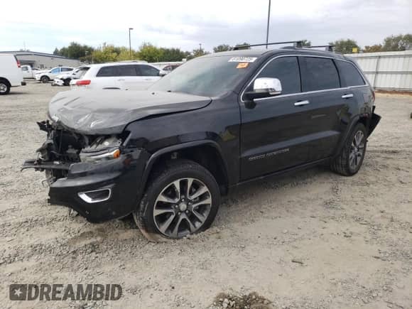 2017 Jeep Grand Cherokee Overland with VIN 1C4RJFCG2HC866857, listed as a Copart auction lot 81090725 with 119,242 mi miles and Salvage title. Bid and sale history available at DreamBid. Image 1.