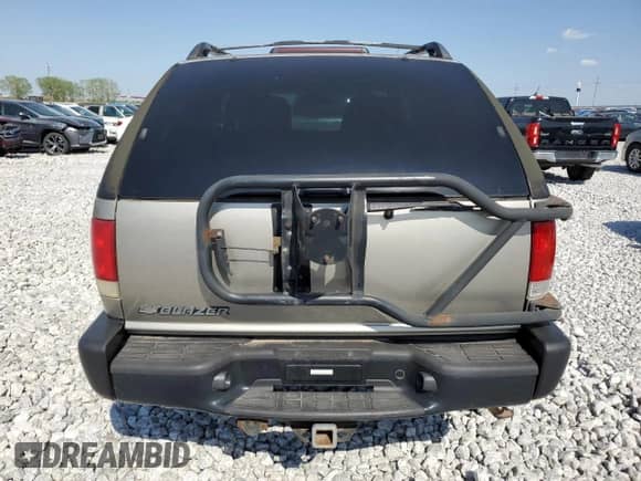 2001 Chevrolet Blazer LS z VIN 1GNCT18W71K130129, wystawiony jako Copart lot #85113764 z przebiegiem 65 992 mil mil oraz Czysty tytuł • Clean title. Historia ofert i sprzedaży dostępna na DreamBid. Obrazek 6.