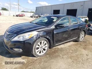 2014 Hyundai Azera Limited с VIN KMHFH4JG0EA385935, выставлен на аукционе Copart как лот 86805355 с пробегом 86 145 миль миль и Списание • Salvage title. История ставок и продаж доступна на DreamBid. Изображение 1.