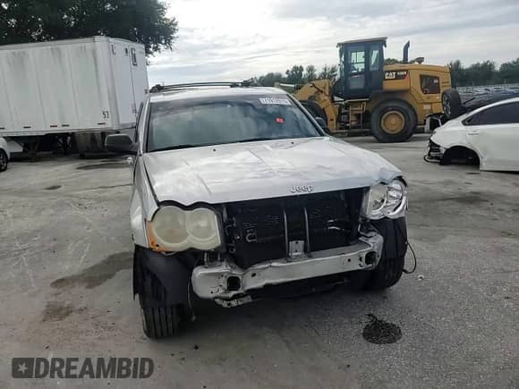 2009 Jeep Grand Cherokee Laredo with VIN 1J8GS48K39C552165, listed as a Copart auction lot 71912915 with 214,755 mi miles and Salvage title. Bid and sale history available at DreamBid. Image 14.