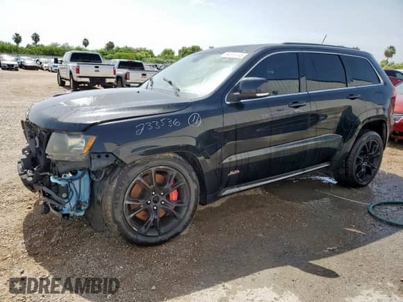 2012 Jeep Grand Cherokee SRT-8 z VIN 1C4RJFDJ2CC352056, wystawiony jako Copart lot #64309145 z przebiegiem 114 808 mil mil oraz Czysty tytuł • Clean title. Historia ofert i sprzedaży dostępna na DreamBid. Obrazek 1.