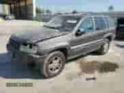 2004 Jeep Grand Cherokee Laredo with VIN 1J4GW48S84C348685, listed as a Copart auction lot 85169715 with 204,660 mi miles and Salvage title. Bid and sale history available at DreamBid. Image 1.