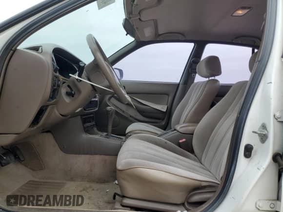 1996 Toyota Camry DX z VIN 4T1BG12K5TU768249, wystawiony jako Copart lot #46368865 z przebiegiem 196 226 mil mil oraz Czysty tytuł • Clean title. Historia ofert i sprzedaży dostępna na DreamBid. Obrazek 7.