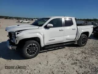 2024 Toyota Tacoma SR5 with VIN 3TYKB5FN6RT000375, listed as a Copart auction lot 87255105 with 7,153 mi miles and Salvage title. Bid and sale history available at DreamBid. Image 1.