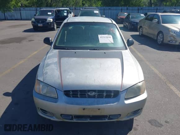 2002 Hyundai Accent GL z VIN KMHCG45C62U336245, wystawiony jako IAAI lot #42312838 z przebiegiem 310 753 mil mil oraz . Historia ofert i sprzedaży dostępna na DreamBid. Obrazek 6.