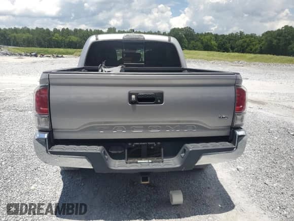2020 Toyota Tacoma SR5 с VIN 5TFAZ5CN1LX090978, выставлен на аукционе Copart как лот 64010265 с пробегом 117 433 миль миль и Списание • Salvage title. История ставок и продаж доступна на DreamBid. Изображение 6.