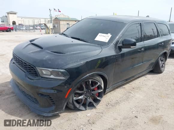 2021 Dodge Durango SRT Hellcat with VIN 1C4SDJH90MC689175, listed as a IAAI auction lot 42244275 with 17,240 mi miles and . Bid and sale history available at DreamBid. Image 2.