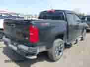 2021 Chevrolet Colorado 4WD Z71 z VIN 1GCGTDEN1M1256939, wystawiony jako IAAI lot #42071364 z przebiegiem 38 972 mil mil oraz . Historia ofert i sprzedaży dostępna na DreamBid. Obrazek 4.