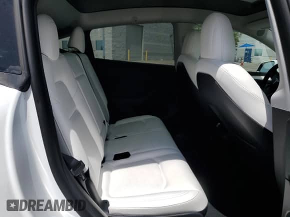 2023 Tesla Model Y Long Range with VIN 7SAYGAEE2PF590760, listed as a Copart auction lot 69752835 with 57,026 mi miles and Salvage title. Bid and sale history available at DreamBid. Image 11.