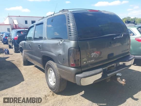 2001 Chevrolet Tahoe LS with VIN 1GNEC13T01R137713, listed as a IAAI auction lot 43080936 with 307,843 mi miles and . Bid and sale history available at DreamBid. Image 3.
