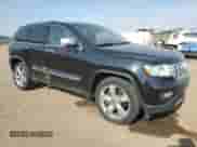 2011 Jeep Grand Cherokee Overland Summit with VIN 1J4RR6GT2BC502360, listed as a Copart auction lot 80379755 with 173,027 mi miles and Salvage title. Bid and sale history available at DreamBid. Image 4.