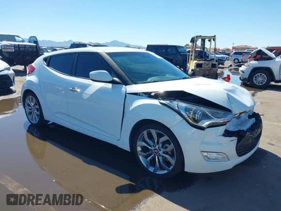 2014 Hyundai Veloster z VIN KMHTC6AD4EU213537, wystawiony jako IAAI lot #43358808 z przebiegiem 54 973 mil mil oraz . Historia ofert i sprzedaży dostępna na DreamBid. Obrazek 1.