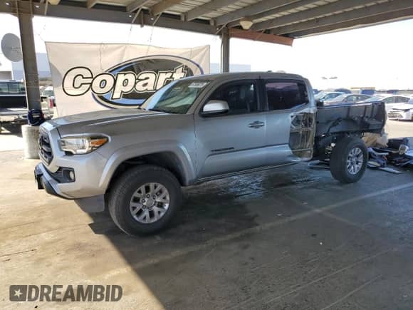 2017 Toyota Tacoma TRD Off Road z VIN 3TMDZ5BNXHM013263, wystawiony jako Copart lot #67589075 z przebiegiem 103 297 mil mil oraz Szkoda całkowita • Salvage title. Historia ofert i sprzedaży dostępna na DreamBid. Obrazek 1.
