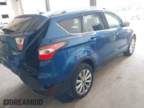 2017 Ford Escape Titanium with VIN 1FMCU9JD3HUA48471, listed as a IAAI auction lot 42686659 with 101,782 mi miles and . Bid and sale history available at DreamBid. Image 4.