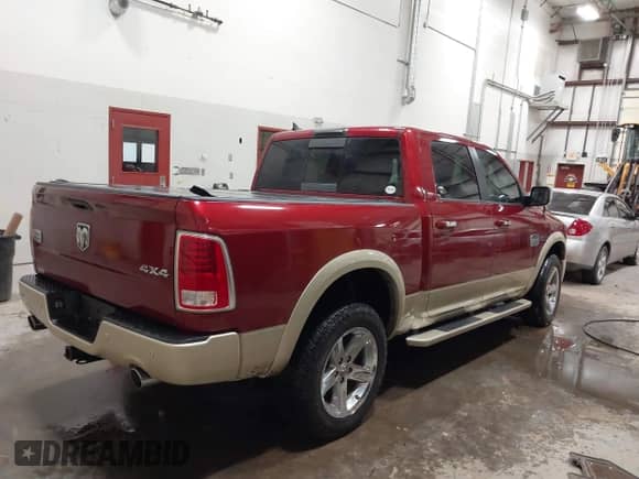 2015 Ram 1500 Laramie Longhorn with VIN 1C6RR7PM0FS532044, listed as a IAAI auction lot 41601998 with 117,649 mi miles and . Bid and sale history available at DreamBid. Image 4.