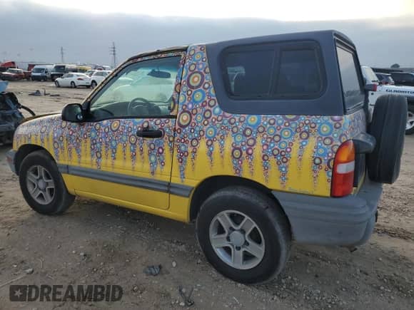 2003 Chevrolet Tracker with VIN 2CNBE18C136928311, listed as a Copart auction lot 84463154 with 118,195 mi miles and Salvage title. Bid and sale history available at DreamBid. Image 2.