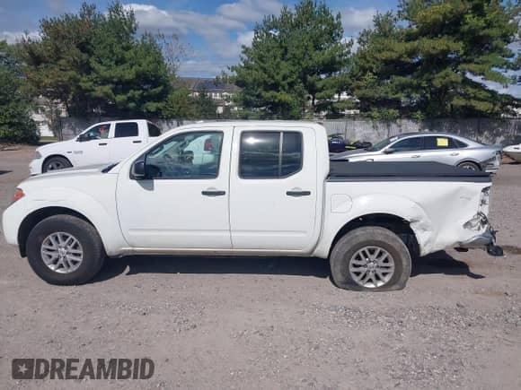 2016 Nissan Frontier SV z VIN 1N6AD0EV5GN795909, wystawiony jako IAAI lot #43356457 z przebiegiem 148 664 mil mil oraz . Historia ofert i sprzedaży dostępna na DreamBid. Obrazek 14.