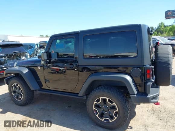 2015 Jeep Wrangler Rubicon Hard Rock z VIN 1C4BJWCG1FL610028, wystawiony jako IAAI lot #42318569 z przebiegiem 48 627 mil mil oraz . Historia ofert i sprzedaży dostępna na DreamBid. Obrazek 14.