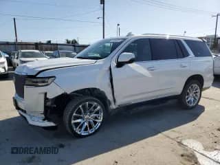 2022 Cadillac Escalade Premium Luxury с VIN 1GYS4BKL6NR153415, выставлен на аукционе Copart как лот 52036525 с пробегом 70 148 миль миль и Списание • Salvage title. История ставок и продаж доступна на DreamBid. Изображение 1.