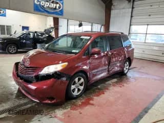 2015 Toyota Sienna LE with VIN 5TDKK3DC6FS560930, listed as a Copart auction lot 86257925 with 104,400 mi miles and Salvage title. Bid and sale history available at DreamBid. Image 1.