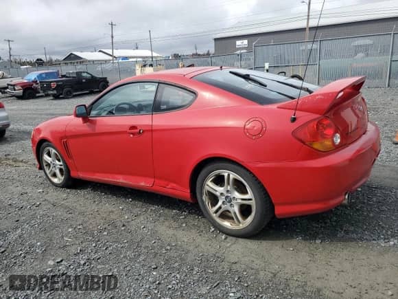 2004 Hyundai Tiburon GT с VIN KMHHN65F24U142204, выставлен на аукционе Copart как лот 50347055 с пробегом 128 040 миль миль и Чистый • Clean title. История ставок и продаж доступна на DreamBid. Изображение 2.