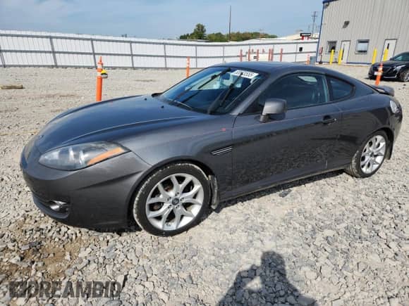 2007 Hyundai Tiburon GT с VIN KMHHN66F37U262161, выставлен на аукционе Copart как лот 80673555 с пробегом 127 895 миль миль и На запчасти • Non repairable. История ставок и продаж доступна на DreamBid. Изображение 1.