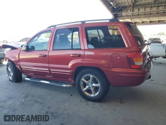 2002 Jeep Grand Cherokee Limited with VIN 1J4GW58N12C202691, listed as a Copart auction lot 64265975 with 118,480 mi miles and Salvage title. Bid and sale history available at DreamBid. Image 2.
