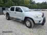 2012 Toyota Tacoma PreRunner with VIN 5TFJU4GN0CX013165, listed as a Copart auction lot 81926475 with 208,907 mi miles and Salvage title. Bid and sale history available at DreamBid. Image 4.