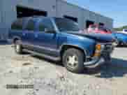 1999 Chevrolet Suburban with VIN 1GNEC16RXXJ381103, listed as a Copart auction lot 80702955 with 169,904 mi miles and Salvage title. Bid and sale history available at DreamBid. Image 4.