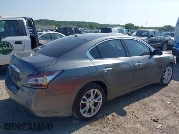 2014 Nissan Maxima SV with VIN 1N4AA5AP6EC443310, listed as a IAAI auction lot 42373390 with 146,828 mi miles and . Bid and sale history available at DreamBid. Image 4.