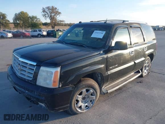 2004 Cadillac Escalade z VIN 1GYEK63N74R304237, wystawiony jako IAAI lot #43427246 z przebiegiem 183 166 mil mil oraz . Historia ofert i sprzedaży dostępna na DreamBid. Obrazek 2.