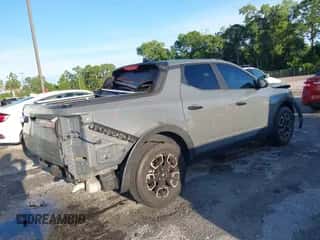 2022 Hyundai Santa Cruz SE with VIN 5NTJA4AE8NH010189, listed as a IAAI auction lot 43287230 with 42,420 mi miles and . Bid and sale history available at DreamBid. Image 4.