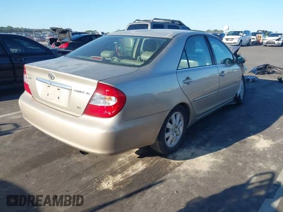 2002 Toyota Camry LE z VIN 4T1BF30K12U540118, wystawiony jako IAAI lot #43395483 z przebiegiem Nie podano mil oraz . Historia ofert i sprzedaży dostępna na DreamBid. Obrazek 4.