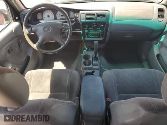2002 Toyota Tacoma PreRunner z VIN 5TEGM92N62Z118802, wystawiony jako Copart lot #66684755 z przebiegiem 216 147 mil mil oraz Szkoda całkowita • Salvage title. Historia ofert i sprzedaży dostępna na DreamBid. Obrazek 8.